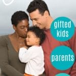 mother, father, and child standing