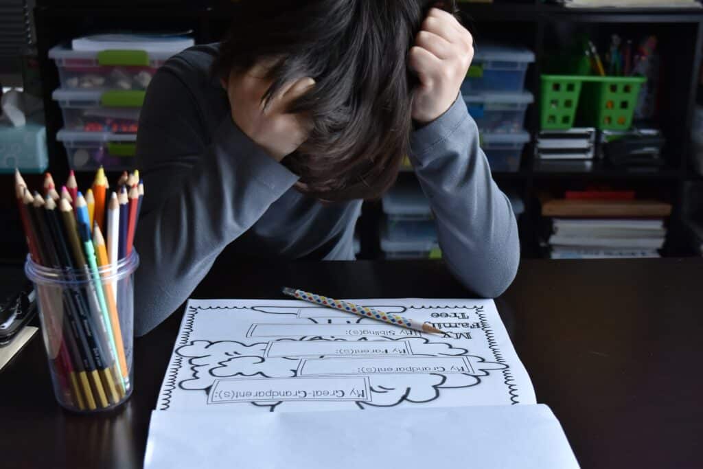 frustrated child looking at work