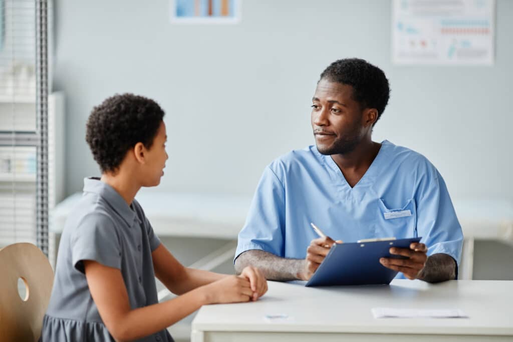 doctor with teen girl
